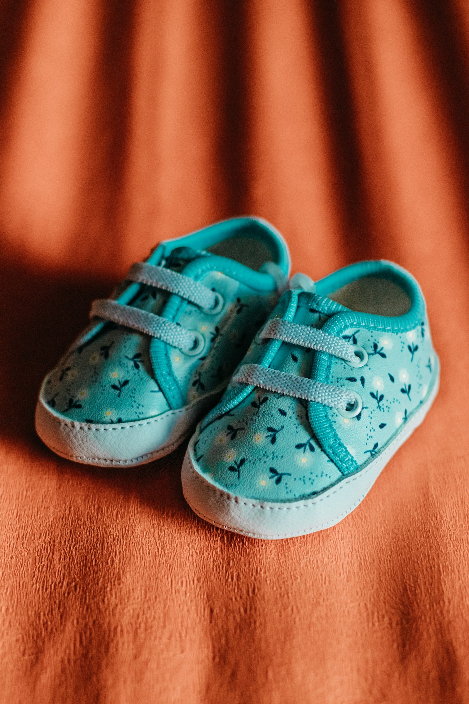 Teal floral baby sneakers