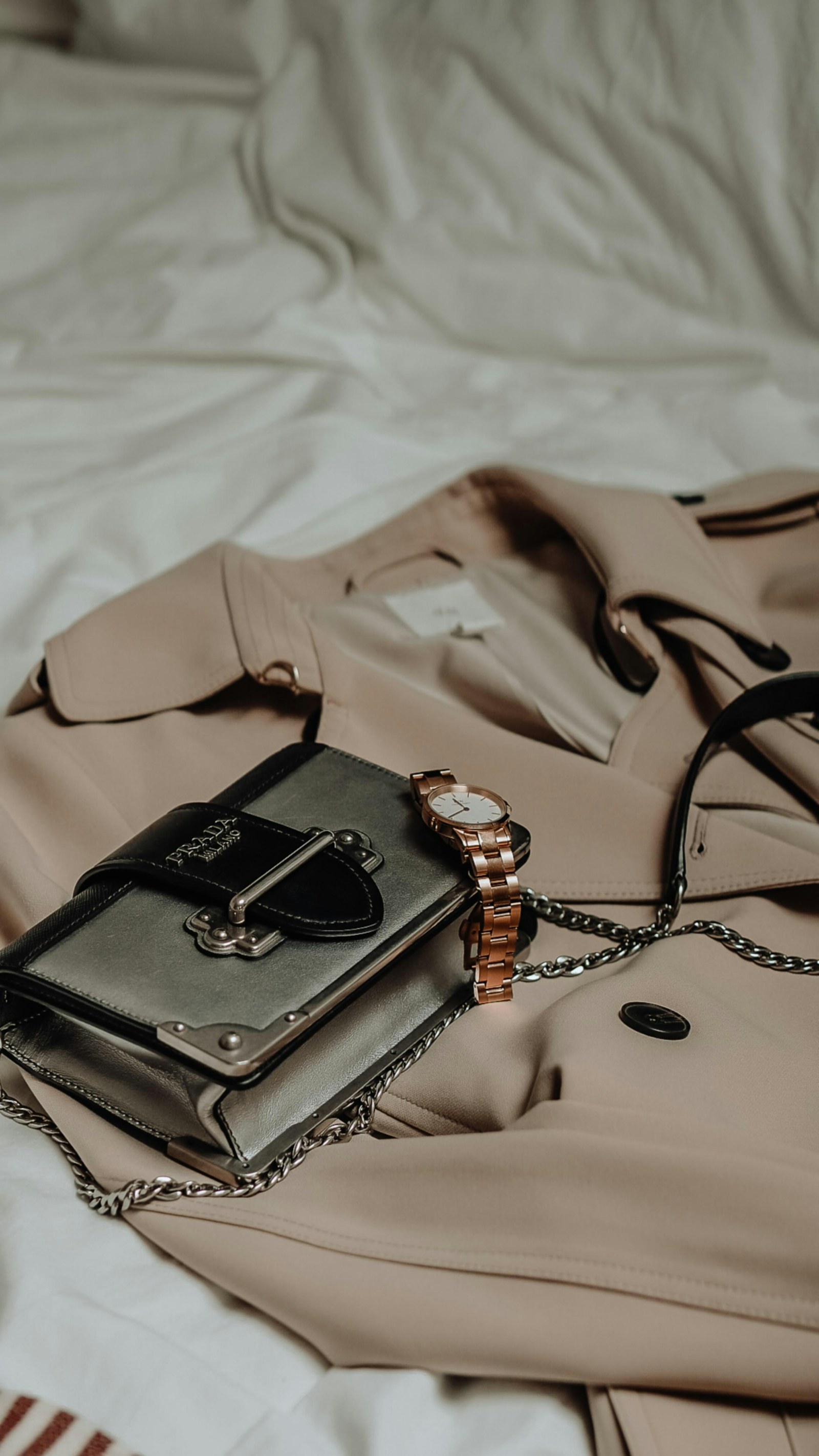 Silver flap crossbody bag with a chain strap
