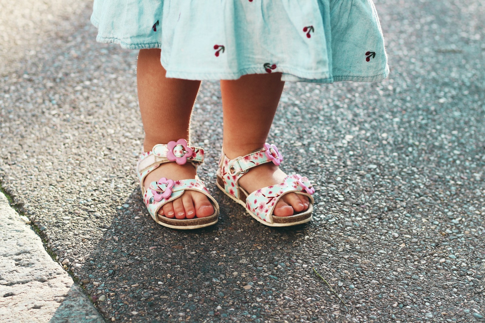 Toddler in pink flower sandals